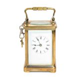 A brass striking carriage clock, circa 1900Condition report: The brass case is discolored. The