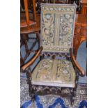 An 18th century open arm chair