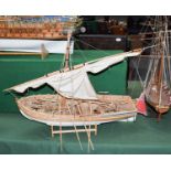 A modern kit built model of a merchant navy single-masted boat, mounted with canon; together with
