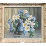 A Nikolska (20th Century) Russian, Still Life of flowers in a vase, signed and dated 1958, oil on