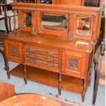 A George V oak mirror back sideboard, with fluted ionic supports and carved door panels raised