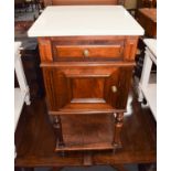 An early 20th century French marble top walnut pot cupboard, with turned supports and under tier,