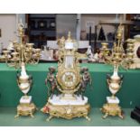A reproduction gilt metal and marble clock garniture, of lyre form, surmounted by a pair of fauns,