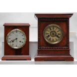 A German striking mantel clock retailed by Woodford, another German striking mantel clock, an Art