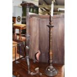 A late 19th century carved mahogany torchere, 140cm high, a circa 1930's oak standard lamp, and a