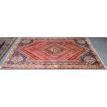Kashgai rug, the lozenge field of flowerheads centred by a stepped medallion framed by spandrels and