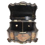 A Victorian papier mache mother of pearl inlaid tea caddy