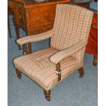 A Victorian mahogany framed upholstered armchair, manner of Howard & Sons