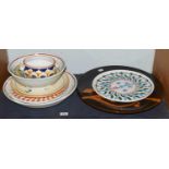 A large Italian Studio pottery charger, decorated with an abstract orange glaze and marked Faenza,
