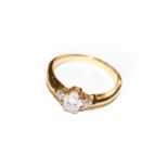 A diamond three stone ring, stamped ‘14K’, finger size M