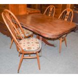 A set of four Ercol elm swan back chairs