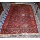 Yomut carpet, the feld of dyrnak güls ensloed by latch hook vine borders, 271cm by 163cm