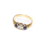 An 18 carat gold sapphire and diamond three stone ring, finger size P