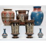 A quantity of Mettlach pottery including a garniture of three vases incised with Grecian figures,