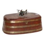 An early 20th century staved teak brass bound table box, surmounted with a model of a bi-plane