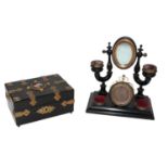A 19th century ebonised and brass mounted casket, set to the top with a porcelain plaque painted