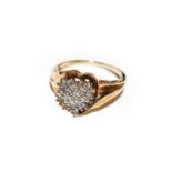 A 9 carat gold heart shaped diamond cluster ring, finger size N1/2