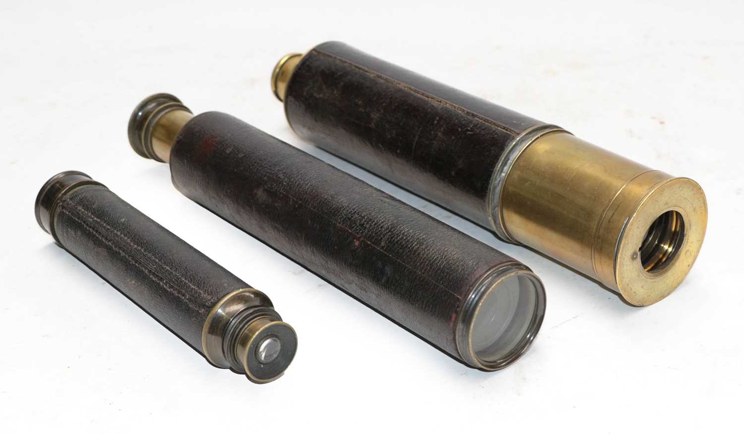 A brass three draw telescope, the leather sleeve with brass plaque engraved "The Lord Bury