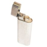 A Cartier silver plated lighter, decorated with reeded mouldings (unboxed)