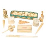 An early 19th-century ivory snuffbox with gold pique inlay, an ivory teetotum gaming piece, a