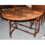 A Georgian oak gateleg dining table