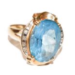 A topaz and diamond ring, stamped '14K', finger size P1/2Condition report: The ring is in good