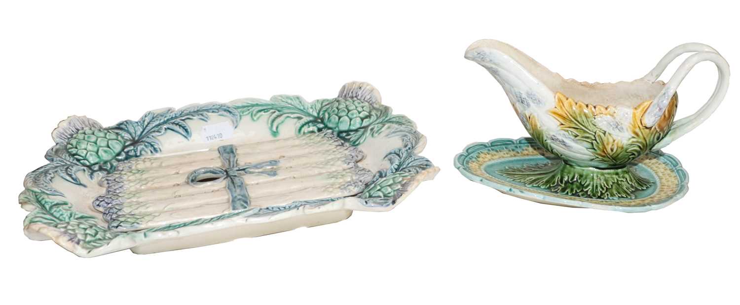 A collection of 19th century Continental Majolica moulded with asparagus and artichokes, including a