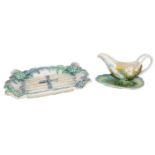 A collection of 19th century Continental Majolica moulded with asparagus and artichokes, including a