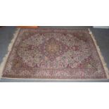 Indian rug, the ivory field of birds and vines centred by a medallion framed by spandrels and