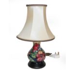 A modern Moorcroft lamp decorated in the Simeon pattern