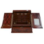 A Victorian figured walnut stationery cabinet, fitted with a perpetual calendar, pair of inkwells,