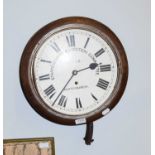 A 19th century oak cased eight-day School room wall-mounted timepiece with 12" painted dial signed