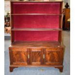 An early 20th century Regency style mahogany waterfall bookcase, with gilt metal gallery and