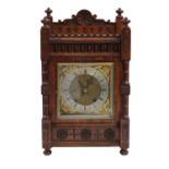 A 19th century German oak cased eight day striking bracket clock, with 6.5" square brass dial,
