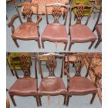 A set of six Georgian style carved mahogany dining chairs, 19th century, with carved and pierced