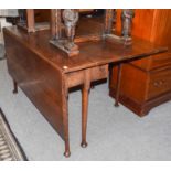 An early 19th century oak gateleg dining table, 139cm by 133cm by 74cm