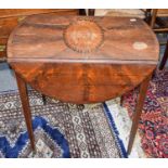 A George III mahogany Pembroke table inlaid with a large patera to the top and raised on slender