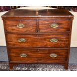 A Georgian mahogany three height chest of drawers with cock beading, oval brush handles, and