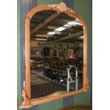 A very large overmantle mirror with moulded frame, 151cm by 135cm, together with a similar pine