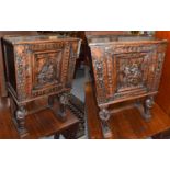 A pair of ornate Continental oak side cabinets (20th century), the panelled doors decorated in