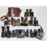 A pair of Second World War binoculars by Taylor-Hobson 1943, in leather case; nine various pairs