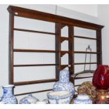 An 18th century oak delft rack, with a pair of three-tier compartments flanking a central section,