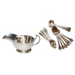 A quantity of silver items comprising; a silver milk jug, set of silver tea spoons, makers mark