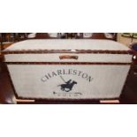 A reproduction and leather mounted ottoman, stencilled for Charleston, Polo, 89cm by 40cm by 43cm