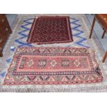 Ushak rug, the soft brick red field with a row of geometric motifs enclosed by serrated leaf and