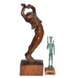 A 20th century carved wooden figure of a Matador raised on an integral plinth; together with a