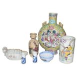 A group of Oriental ceramics including a Chinese yellow grand moon flask, an 18th-century sauceboat,