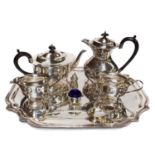 A plated tray, four-part plated tea service, silver George III berry spoon, silver salt and pepper