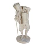 An early 20th century Japenese ivory okimono of an old man carrying a lantern, bearing two character