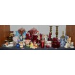 A selection of glass and ceramics, consisting of cranberry glass, a pair of Victorian brass